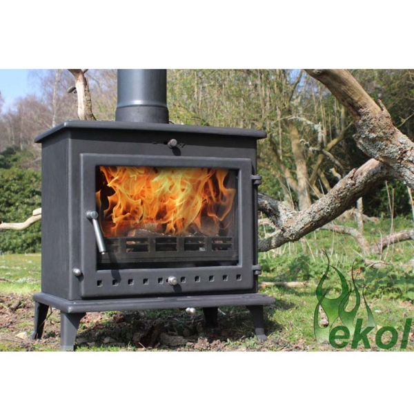 Ekol Crystal 12 woodburning stove by a tree
