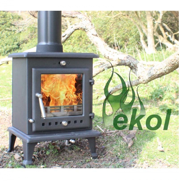 Ekol Crystal 5 woodburning stove multi fuel by a tree
